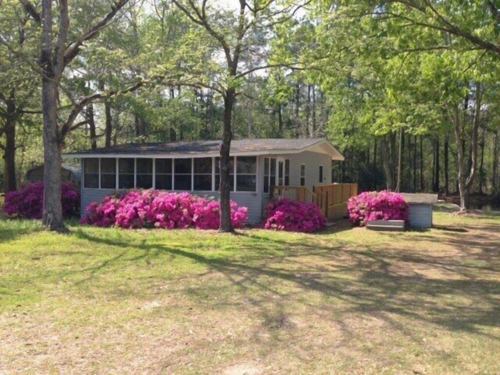 Front Image of Vacation Rental House: Completely renovated lake house with boat landing, dock, fire pit and deck!